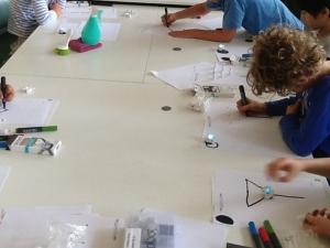 Students working with ozobots