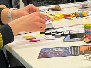 teacher using bottle caps for maths activity
