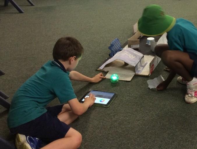 students using sphero on obstacle course