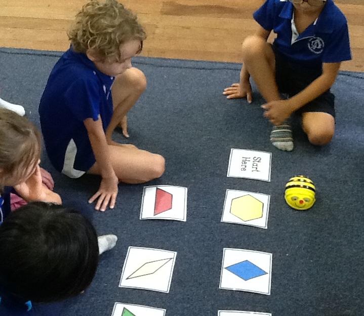 Casa Mia studients using Beebots