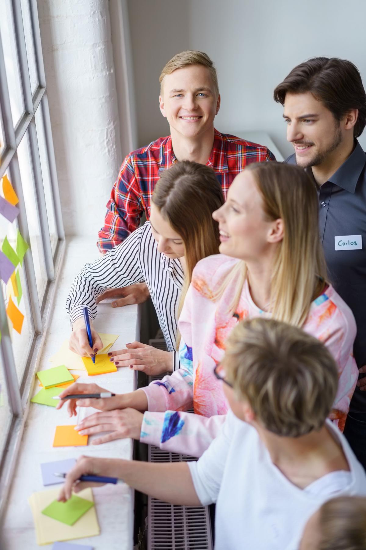 Group of adults with post it notes